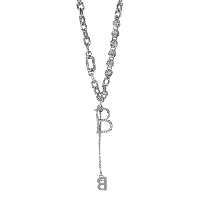 Collier rétro petit ange géométrique tempérament imitation perle collier pompon croix en forme de Y